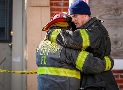 Officials: 3 Baltimore firefighters injured; 4th trapped