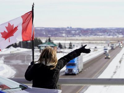 Convoy of truckers funded by online donations drive on Canadian capital to oppose border vaccine mandates