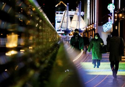 Japan doubles areas under COVID curbs as cases set records