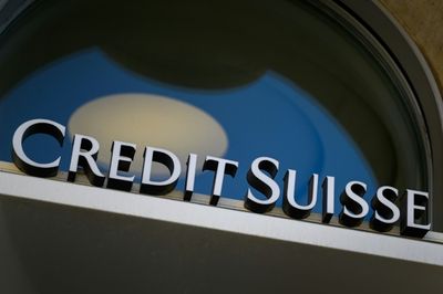 Scandal-plagued Credit Suisse warns profits to take hit