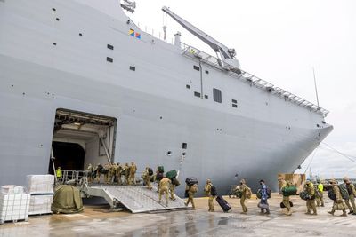 Covid outbreak on crucial Australian aid ship bound for tsunami-battered Tonga