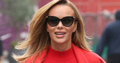 Amanda Holden stands out in an all-red ensemble as she leaves Heart Radio