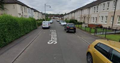 Police lock down residential Glasgow street after reports of 'gunshots' fired at window