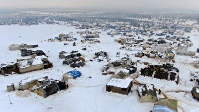 Snow storms, cold and fire threaten displaced Syrians in northern camps