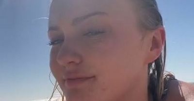 Woman captures creepy man taking pictures of her as she sunbathes on the beach