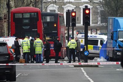 Woman fatally stabbed in street by ex-partner who was then hit by car