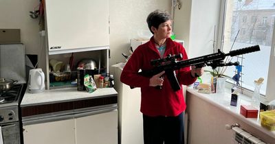 Ukrainian mum buys huge rifle, helmet and camouflage gear in fear of Russian invasion