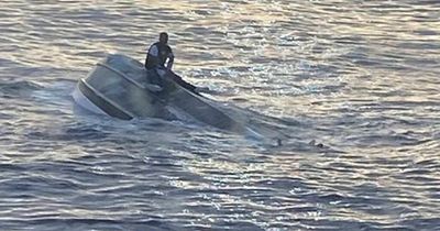 Hunt launched after boat with 39 people capsizes in 'human smuggling attempt'