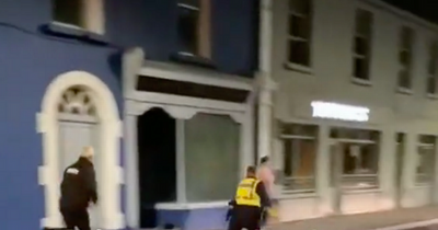 Irish pubs: Dramatic footage shows gardai chase down and arrest young man kicking in bar door