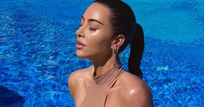 Kim Kardashian shows off impossibly smaller bum in very skimpy bikini on luxury break
