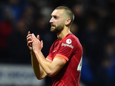 Liverpool defender Nat Phillips being chased by two Premier League clubs