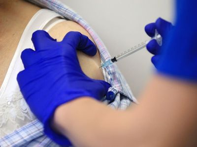 Coronavirus vaccines reduce risk of long Covid, study suggests