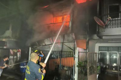 Two killed in house fire, wife badly burned