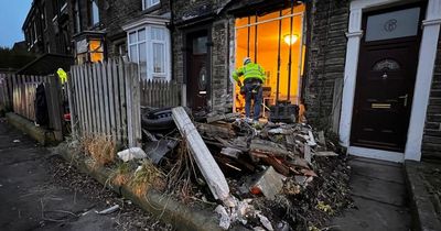 Car which ploughed into house leaving trail of wreckage was being chased after failing to stop for police