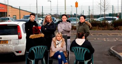 Residents in deck chairs form 'barricade' to stop school drop offs on street