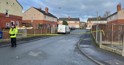 Shooter remains at large and multiple police cordons in place after two men gunned down