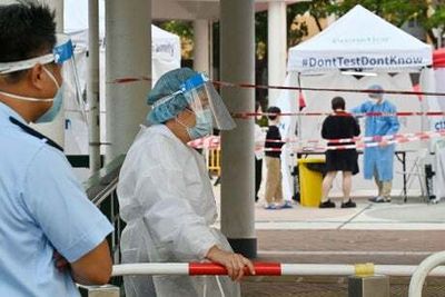 Hong Kong cuts Covid quarantine to 14 days but UK flight ban remains