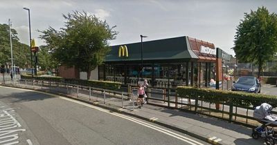 Police closed road after woman hit by car outside McDonald's