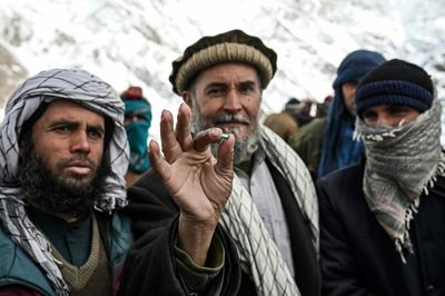 Ex-government workers mine for salvation in Afghan mountains