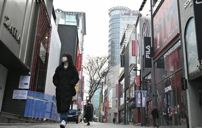 As Omicron pushes the West to reopen, Asia hunkers down