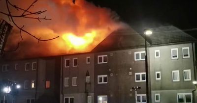 Fire crews battle huge blaze at Livingston flats as 15 appliances descend on scene