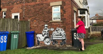 Woman wakes up to discover huge mural painted on the side of her home