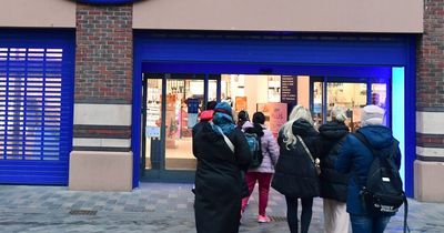 Boots shoppers queuing in Clayton Square before store opens for 70% off sale