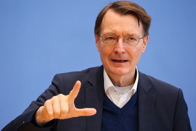 Germany says omicron surge 'under control' despite records