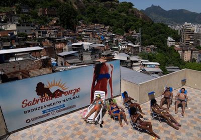 Perfect tans, less COVID cares on Rio de Janeiro rooftop