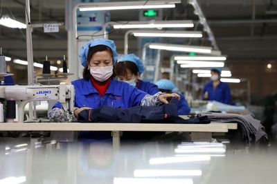 China factory activity edges down in January amid Covid outbreaks