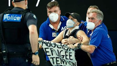 Aus Open Men’s Final Paused As Protestor Drops 3 Metres Onto The Court, Is Swarmed By Security