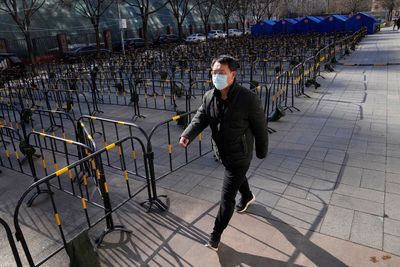 Beijing seals off more residential areas, reports 12 cases