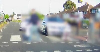 Chilling moment reckless driver narrowly misses little girl on zebra crossing