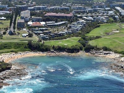 Man and boy swept off rocks and die