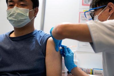Japan starts mass COVID boosters as omicron cases soar