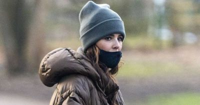 Cheryl stuns in a rare public appearance as she takes her beloved dachshund for walkies