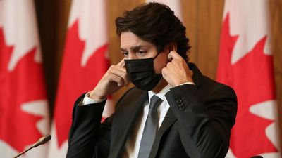Canada's Justin Trudeau "feeling fine" after testing positive for COVID