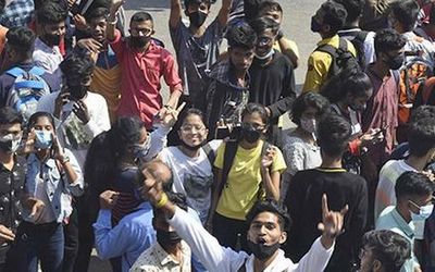 Students take to streets, seek cancellation of offline exams