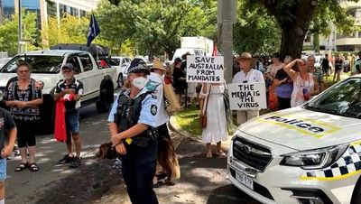 Protesters chant 'arrest ScoMo' outside National Press Club