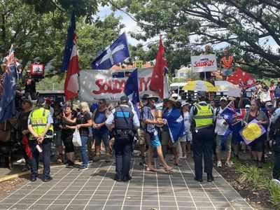 Protesters gather outside PM speech venue