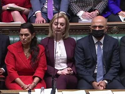 Maskless Liz Truss pictured huddled with ministers in Commons hours before testing positive for Covid