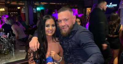 UFC star Conor McGregor poses with one of the 'Dubai two' in his Dublin pub