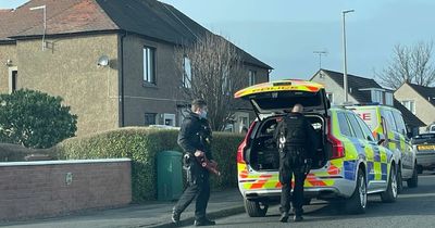 Armed cops storm Scots street amid reports of ongoing incident