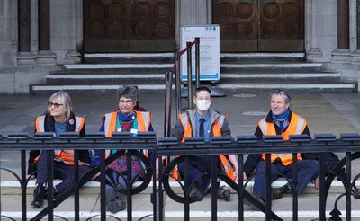 Insulate Britain protesters in custody after gluing themselves to court steps