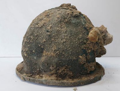 Ancient helmets, temple ruins found at dig in southern Italy