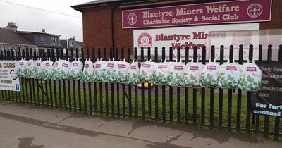 Lanarkshire store hangs bags of clothes on railings to ensure people are kept warm this winter