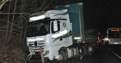 HGV lorry plunges off Scots road after crashing with car head-on