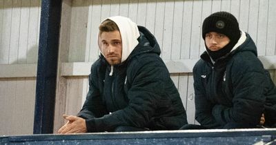 David Goodwillie sits dejected in the stands at Raith Rovers game as club back him despite backlash