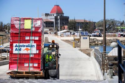 Virus arrives along with aid in Tonga, triggering lockdown