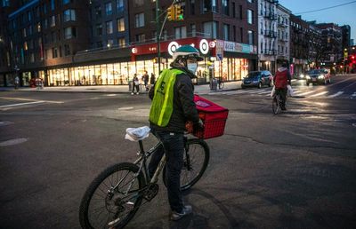 Food delivery workers, ride-share drivers demand more rights
